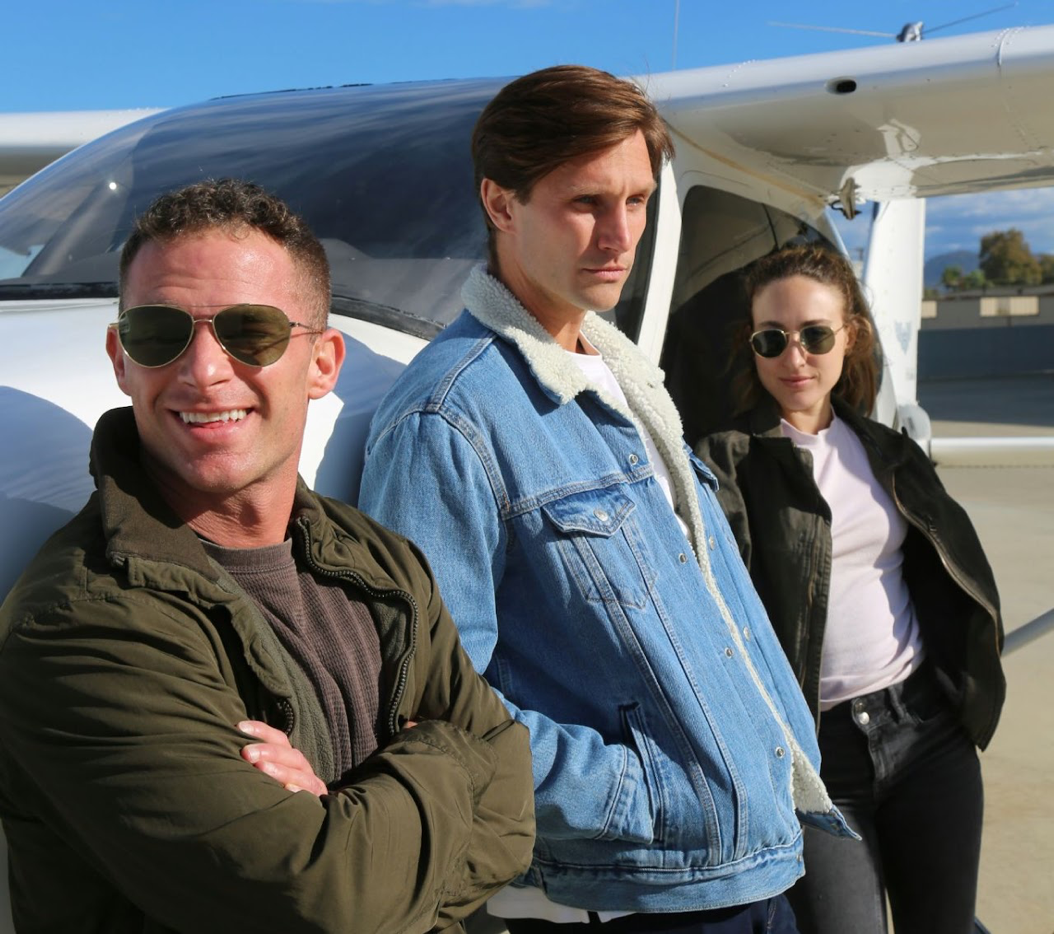 People standing near a general aviation aircraft